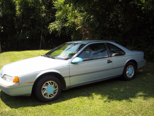 Blue 1991 Ford Thunderbird Coupe with blue/black interior