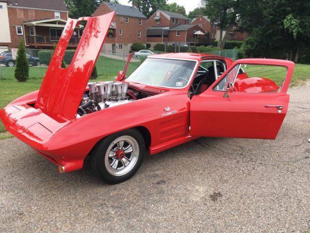 Red 1964 Chevrolet Corvette Coupe with Red & Black interior