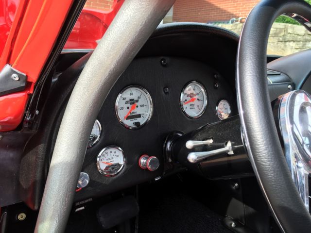 Red 1964 Chevrolet Corvette Coupe with Red & Black interior