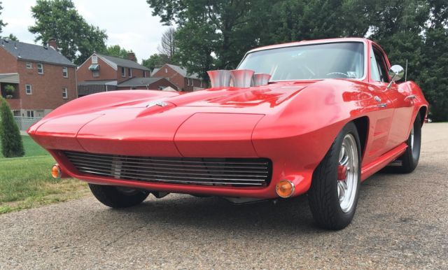 Red 1964 Chevrolet Corvette Coupe with Red & Black interior