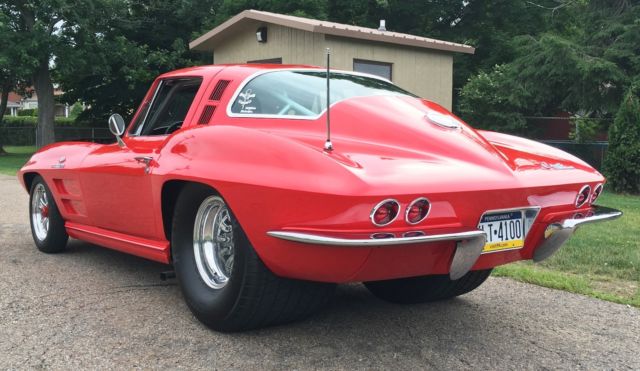 Red 1964 Chevrolet Corvette Coupe with Red & Black interior