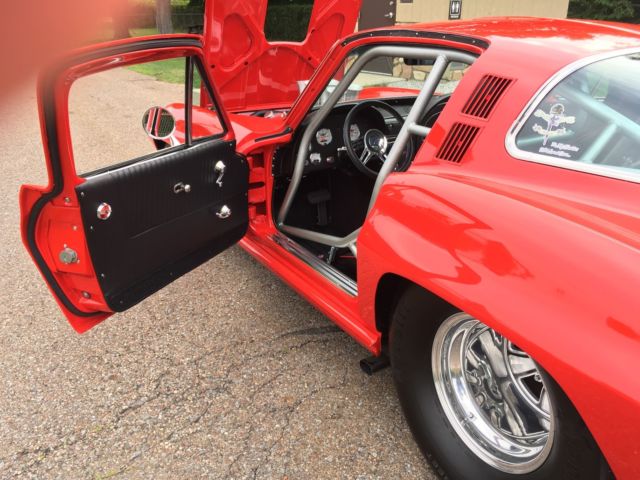 Red 1964 Chevrolet Corvette Coupe with Red & Black interior