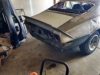 Unpainted 1971 Chevrolet Camaro Coupe with Green and black interior