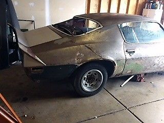 Unpainted 1971 Chevrolet Camaro Coupe with Green and black interior