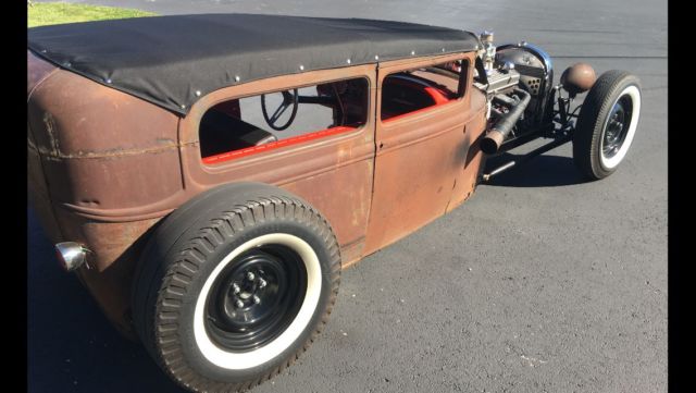 Rust 1930 Ford Model A with Red interior