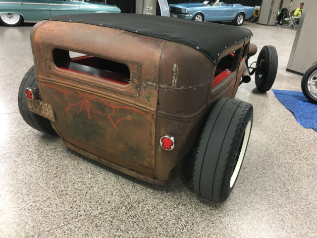 Rust 1930 Ford Model A with Red interior