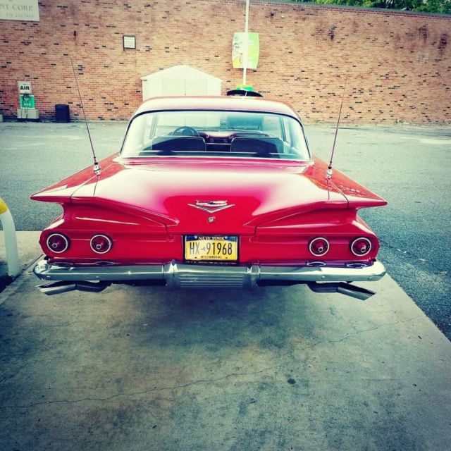 Red 1960 Chevrolet Bel Air/150/210 Coupe with Gray interior