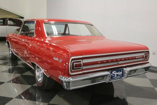 Red 1965 Chevrolet Chevelle Hardtop with White interior
