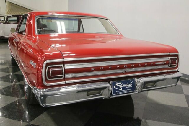 Red 1965 Chevrolet Chevelle Hardtop with White interior