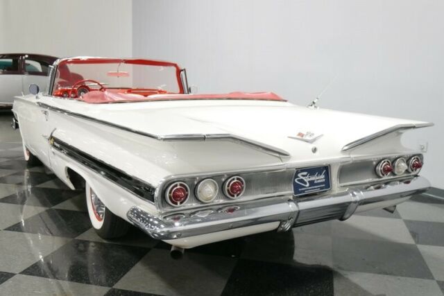 White 1960 Chevrolet Impala Convertible with Red interior
