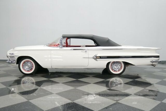 White 1960 Chevrolet Impala Convertible with Red interior