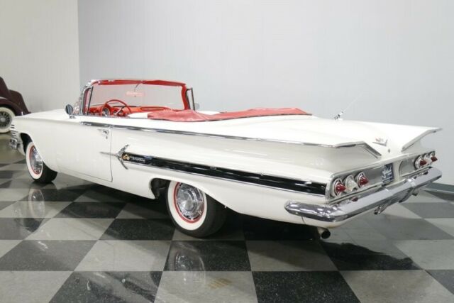 White 1960 Chevrolet Impala Convertible with Red interior