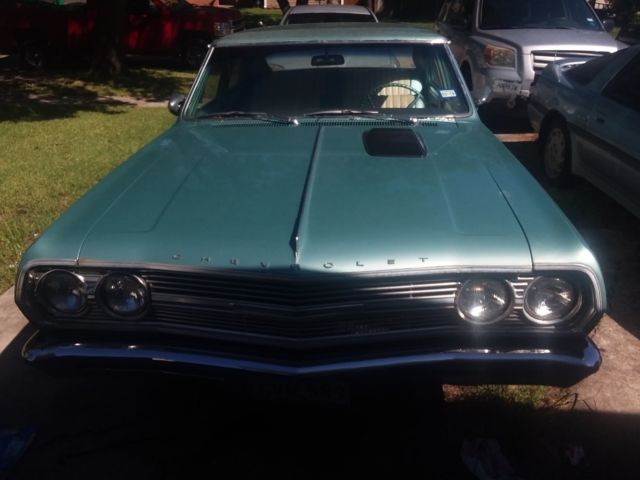 Green 1965 Chevrolet Chevelle Sedan with Teal interior