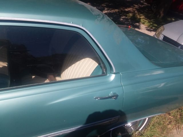 Green 1965 Chevrolet Chevelle Sedan with Teal interior