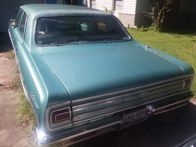 Green 1965 Chevrolet Chevelle Sedan with Teal interior