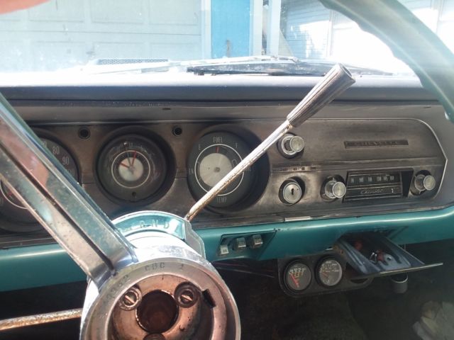 Green 1965 Chevrolet Chevelle Sedan with Teal interior