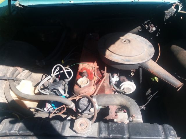 Green 1965 Chevrolet Chevelle Sedan with Teal interior