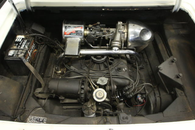 White 1964 Chevrolet Corvair Convertible with Red interior